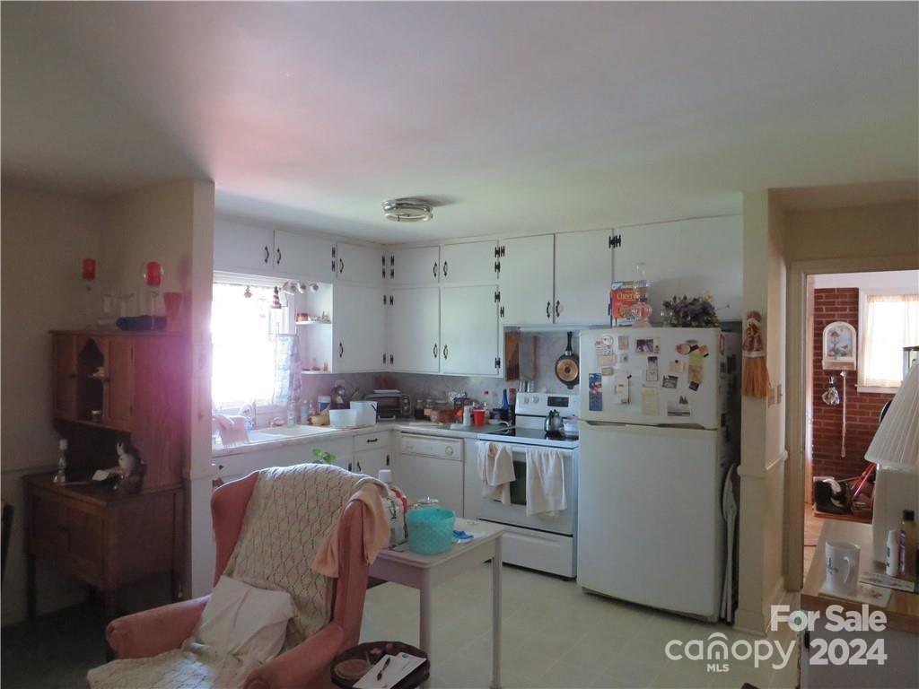 816 Poors Ford Road Rutherfordton, NC 28139 - Photo 19 of 23 a kitchen with refrigerator and cabinets