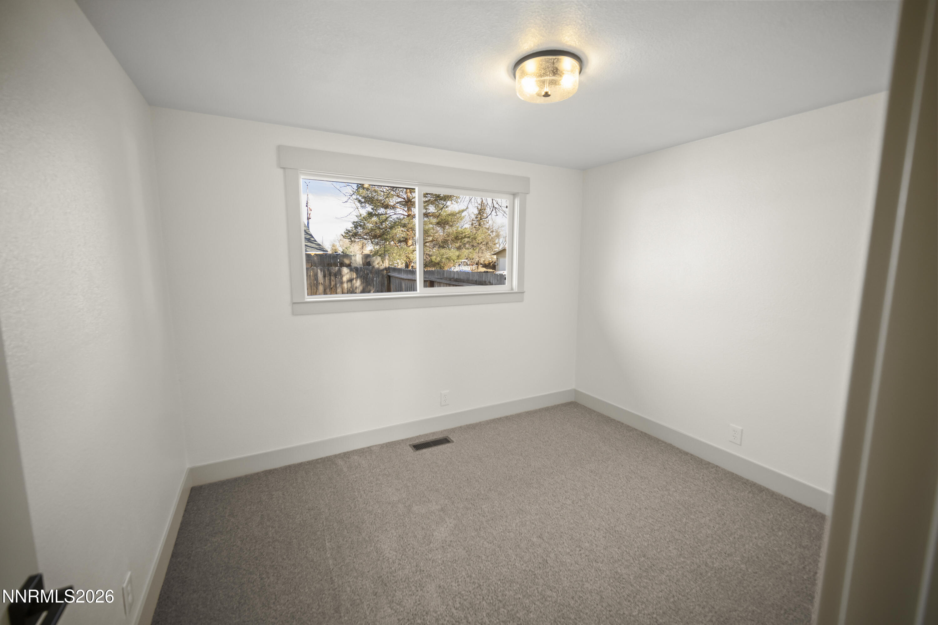 308 Shawna Way Yerington, NV 89447 - Photo 20 of 37 an empty room with windows