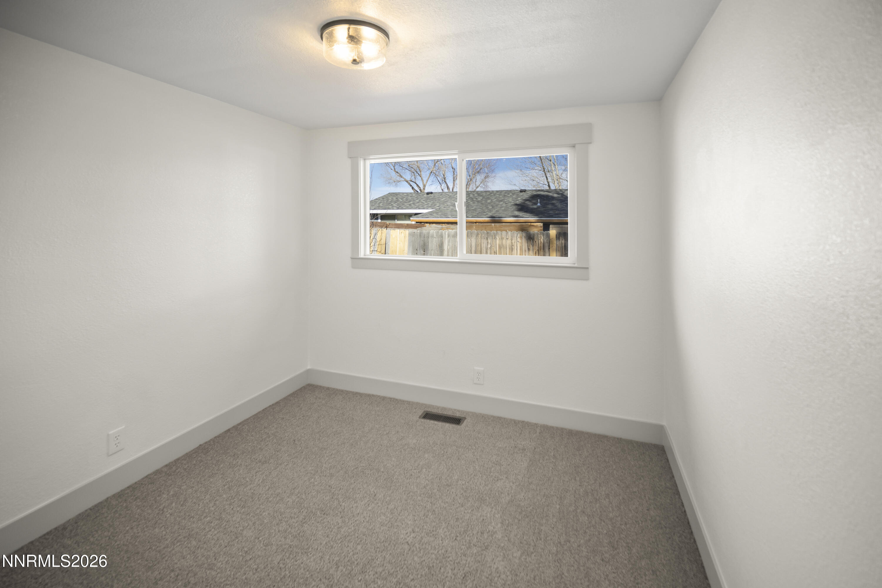 308 Shawna Way Yerington, NV 89447 - Photo 22 of 37 an empty room with a window