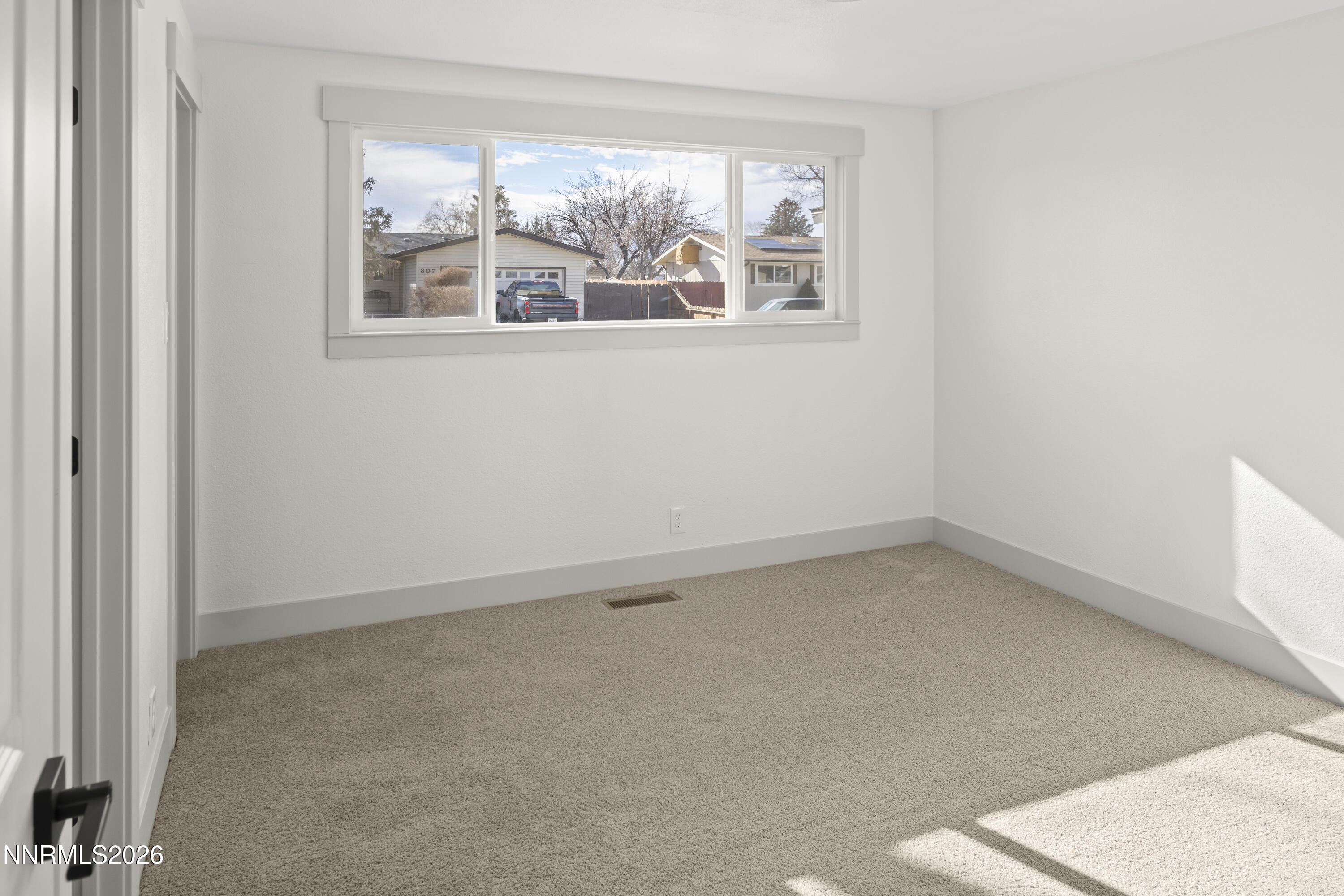 308 Shawna Way Yerington, NV 89447 - Photo 23 of 37 an empty room with a window