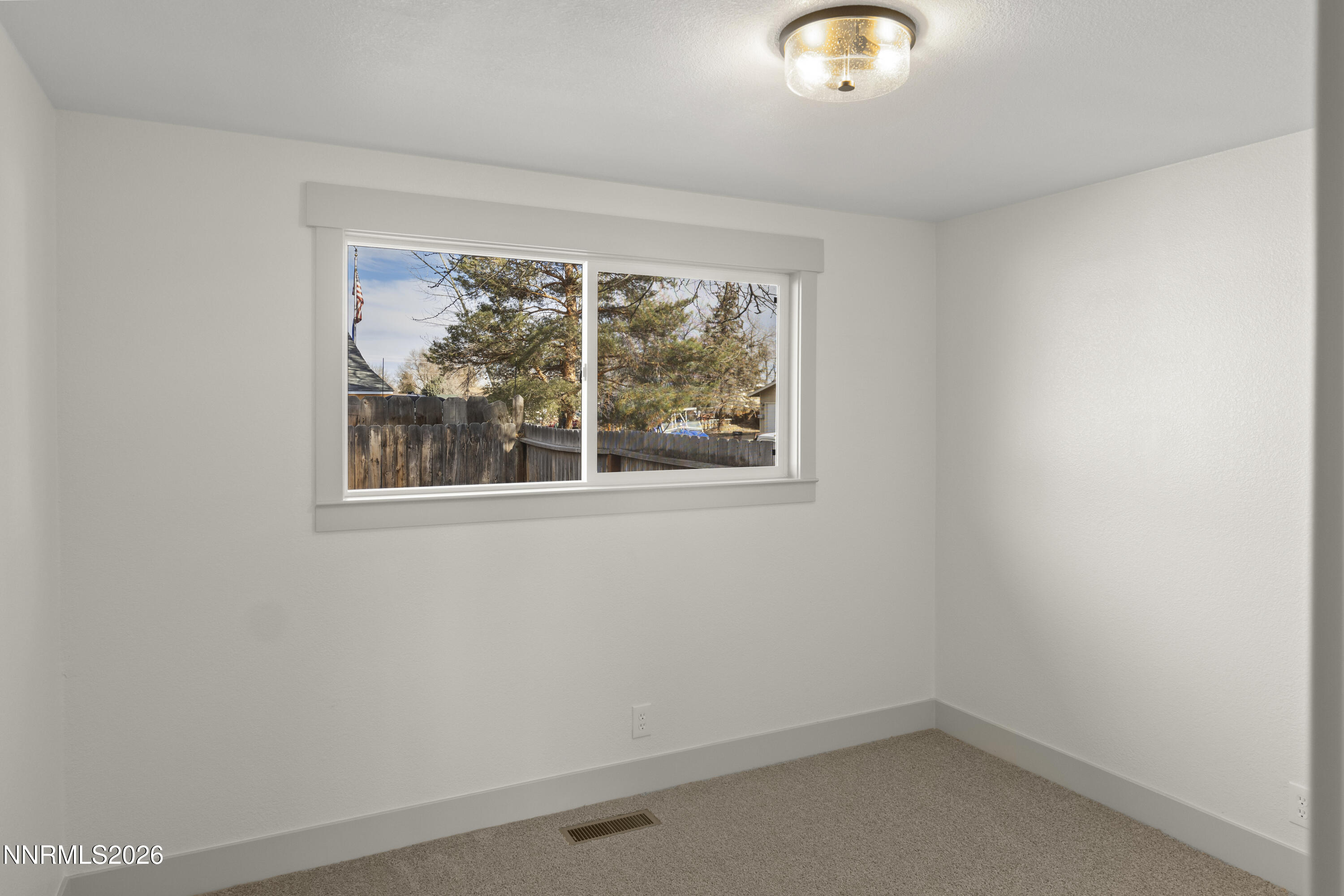 308 Shawna Way Yerington, NV 89447 - Photo 24 of 37 an empty room with a window