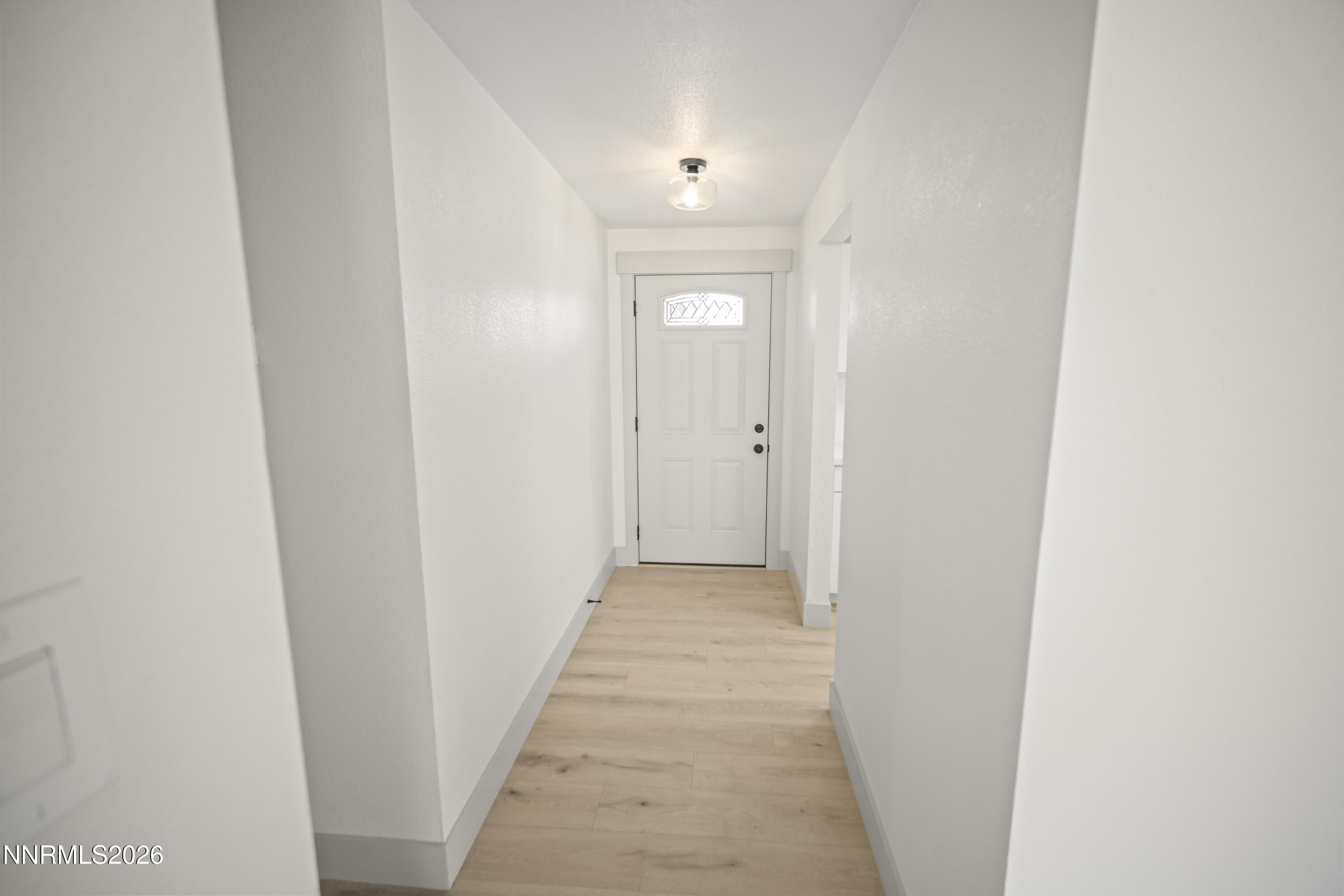 308 Shawna Way Yerington, NV 89447 - Photo 26 of 37 a view of a hallway with wooden floor