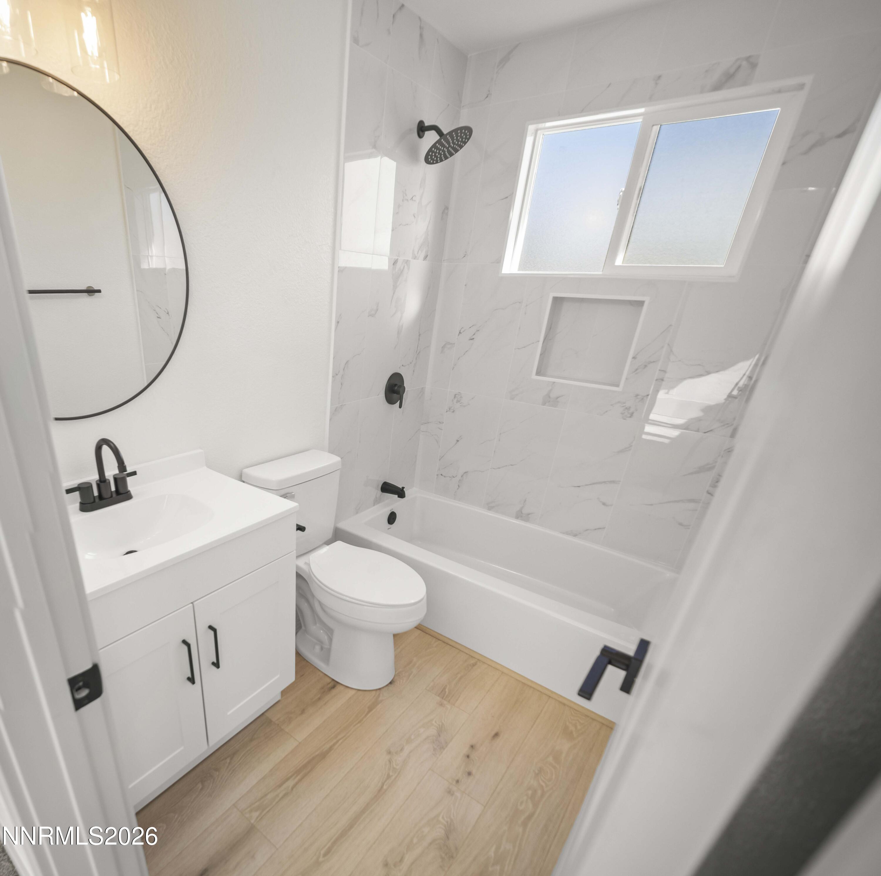 308 Shawna Way Yerington, NV 89447 - Photo 28 of 37 a bathroom with a sink a toilet and a mirror