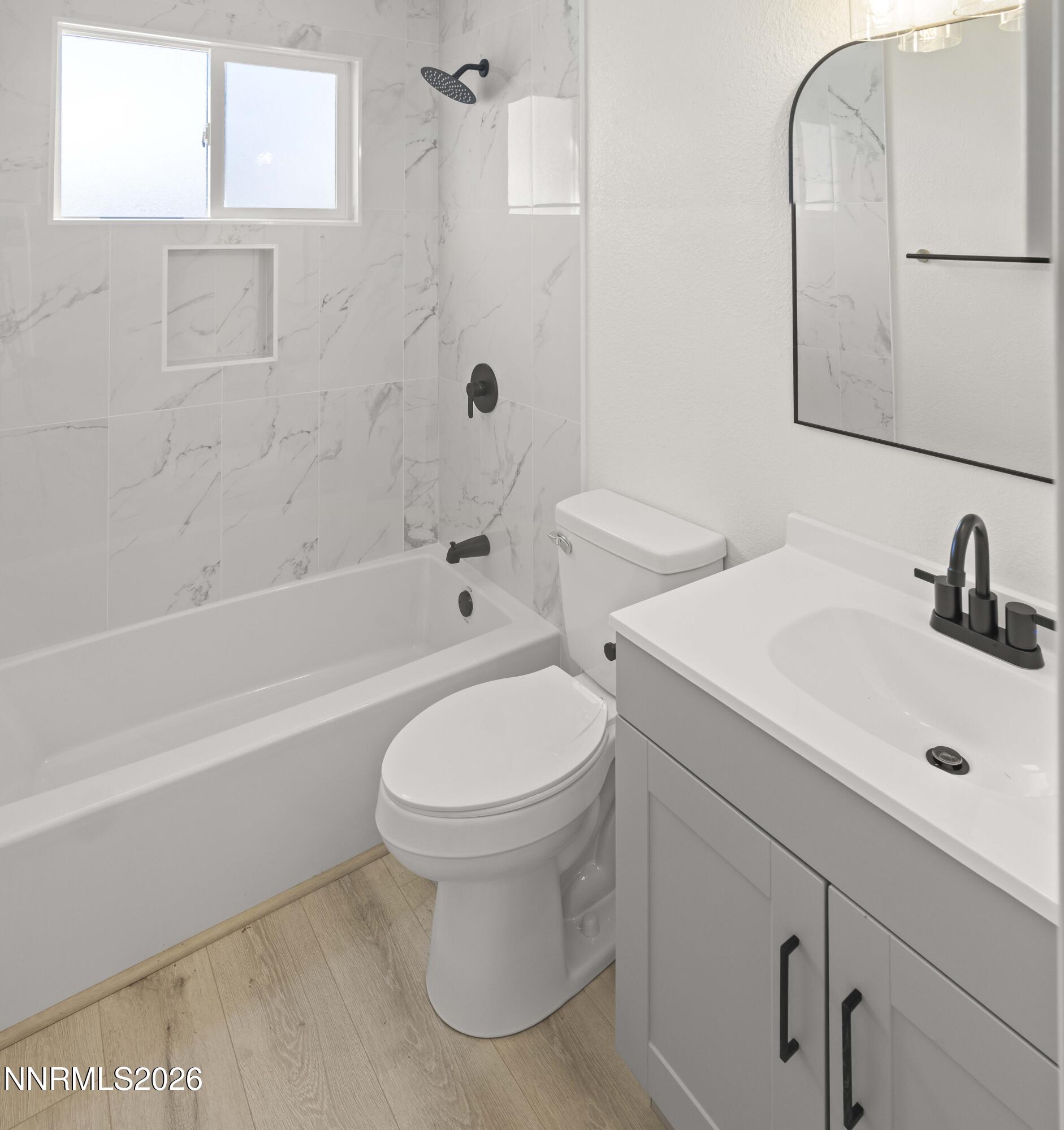 308 Shawna Way Yerington, NV 89447 - Photo 29 of 37 a bathroom with a sink toilet and shower