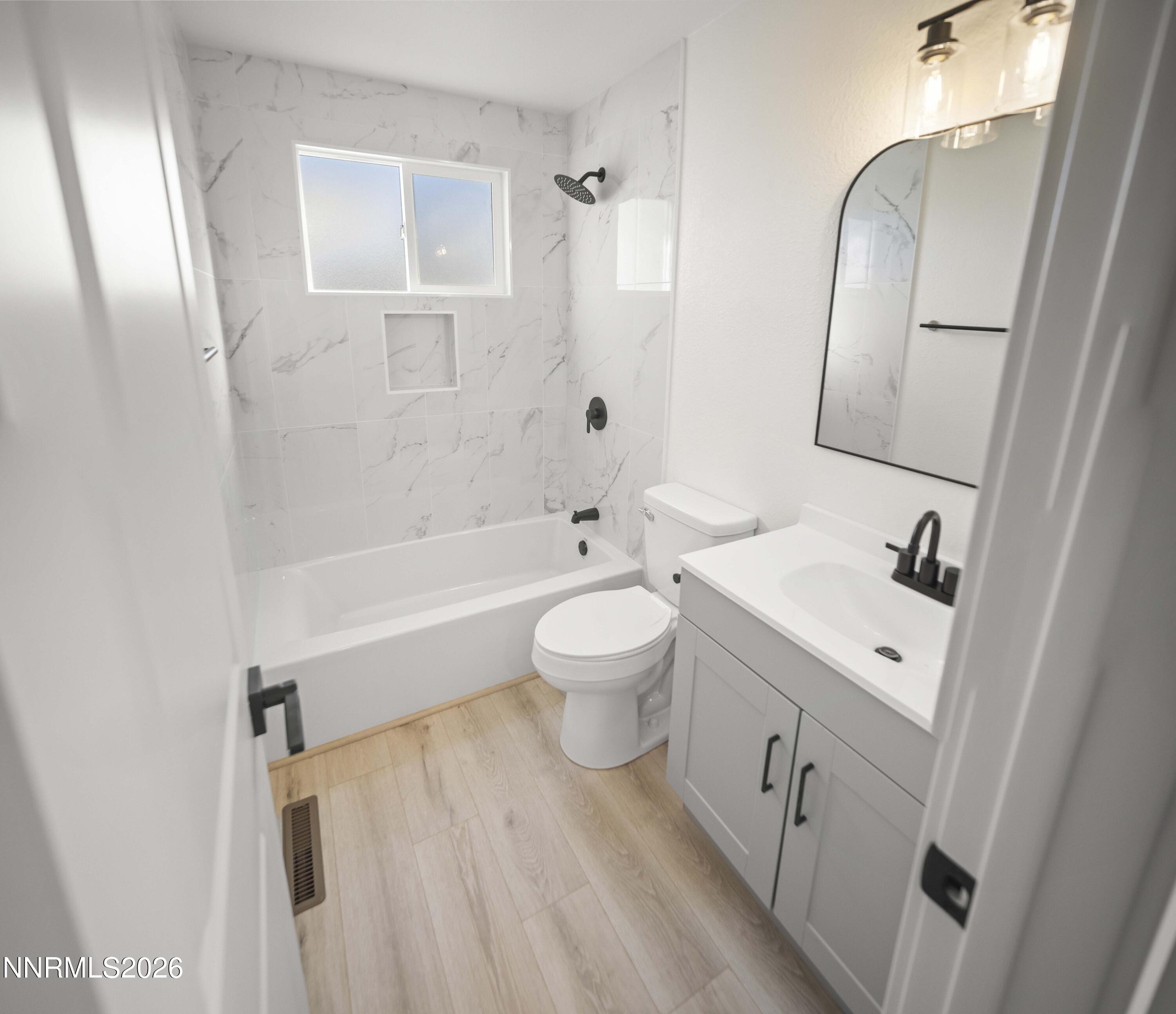 308 Shawna Way Yerington, NV 89447 - Photo 30 of 37 a bathroom with a toilet sink and mirror