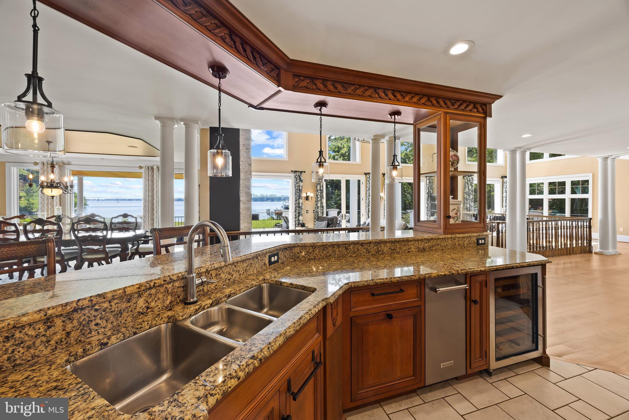 125 South Winchester Road Annapolis, MD 21409 - Photo 14 of 47 a view of a kitchen with granite countertop a sink and a wooden floors