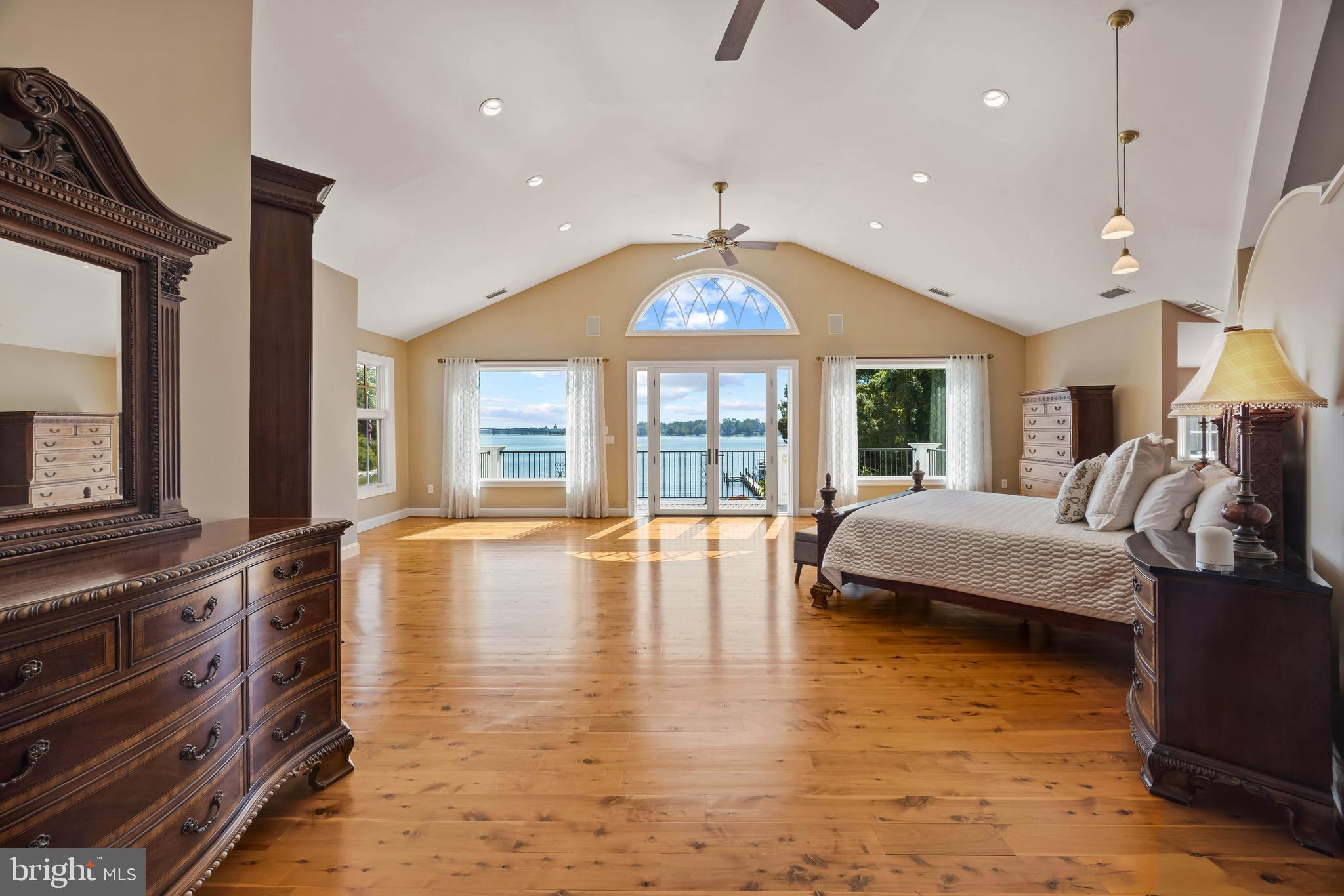 125 South Winchester Road Annapolis, MD 21409 - Photo 18 of 47 a spacious bedroom with a large bed and a large window