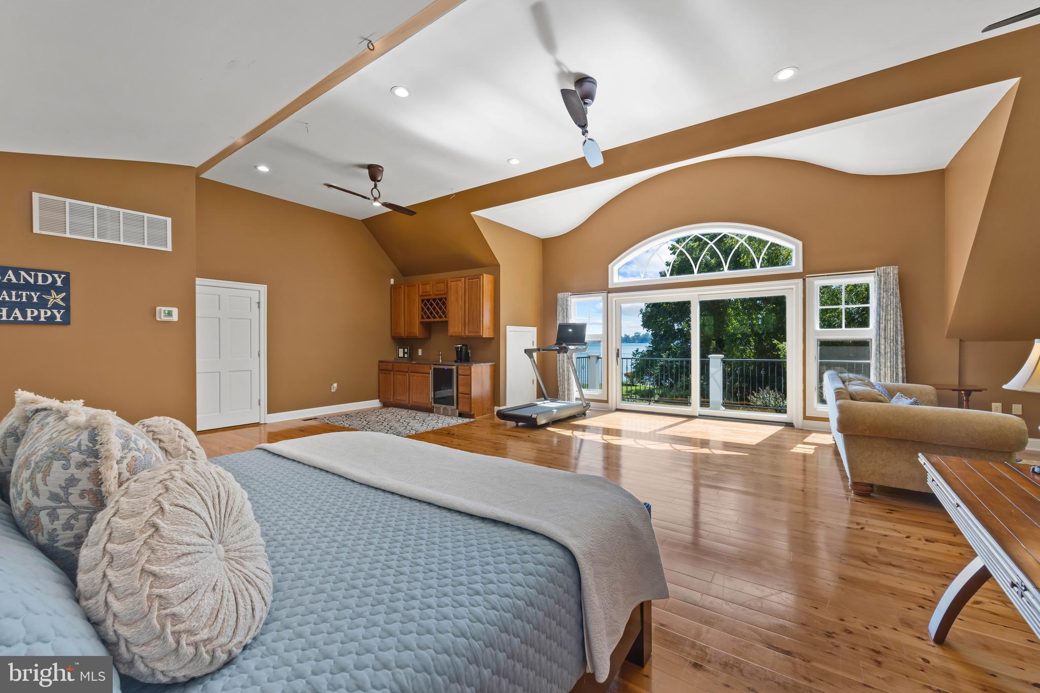 125 South Winchester Road Annapolis, MD 21409 - Photo 31 of 47 a spacious bedroom with a large bed and a large window