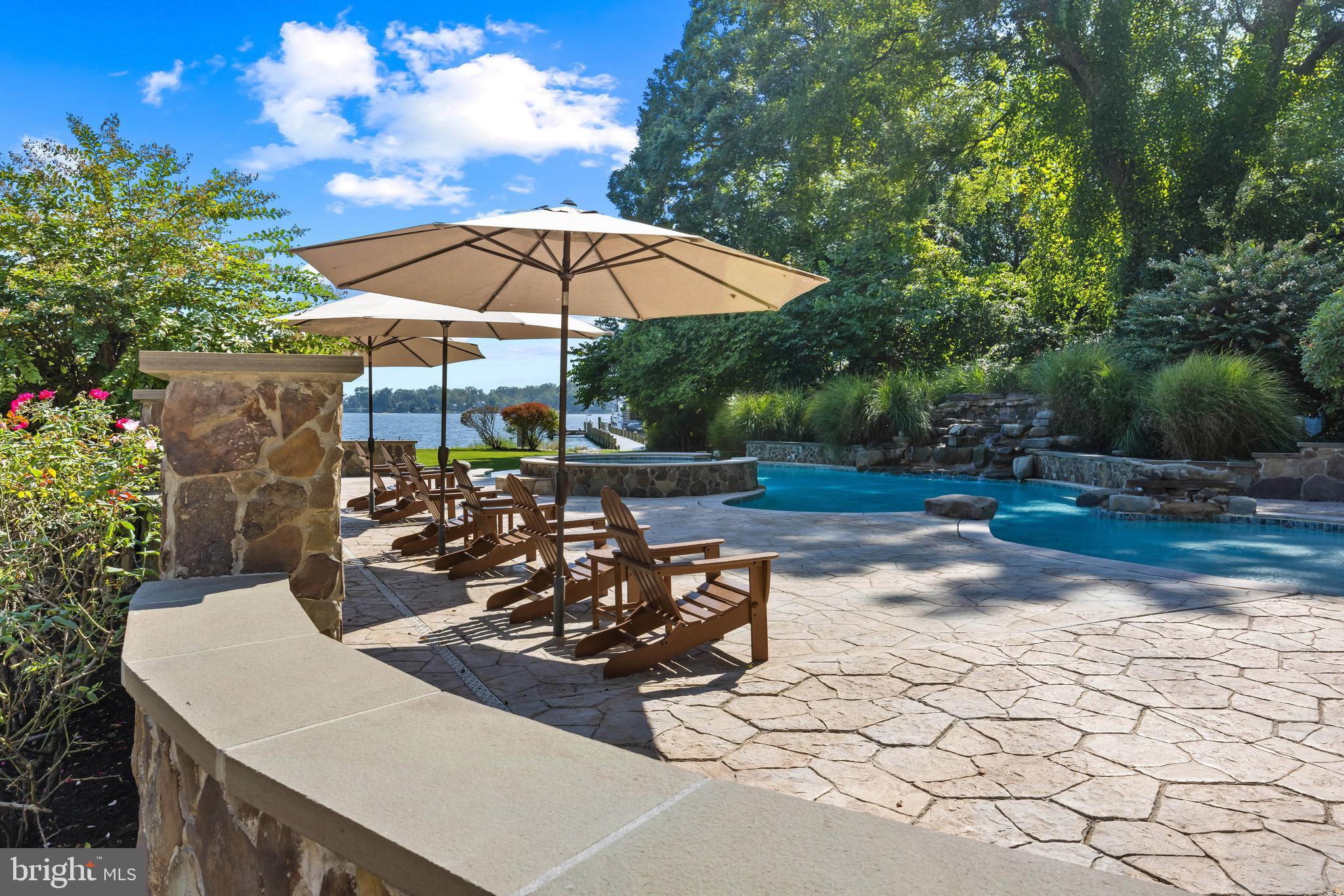 125 South Winchester Road Annapolis, MD 21409 - Photo 41 of 47 a view of a patio with table and chairs under an umbrella