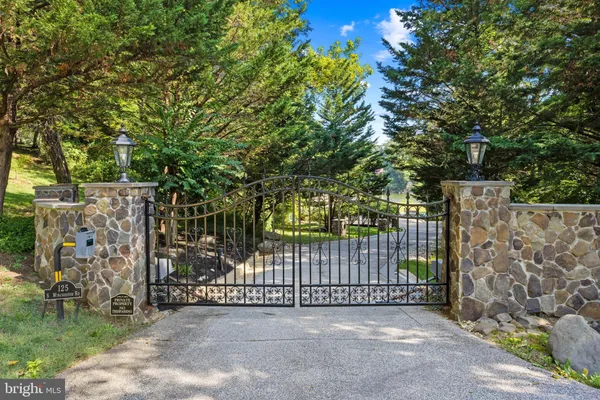 a view of a gate with a small yard