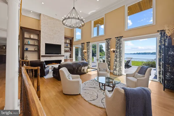 a living room with fireplace furniture and a flat screen tv