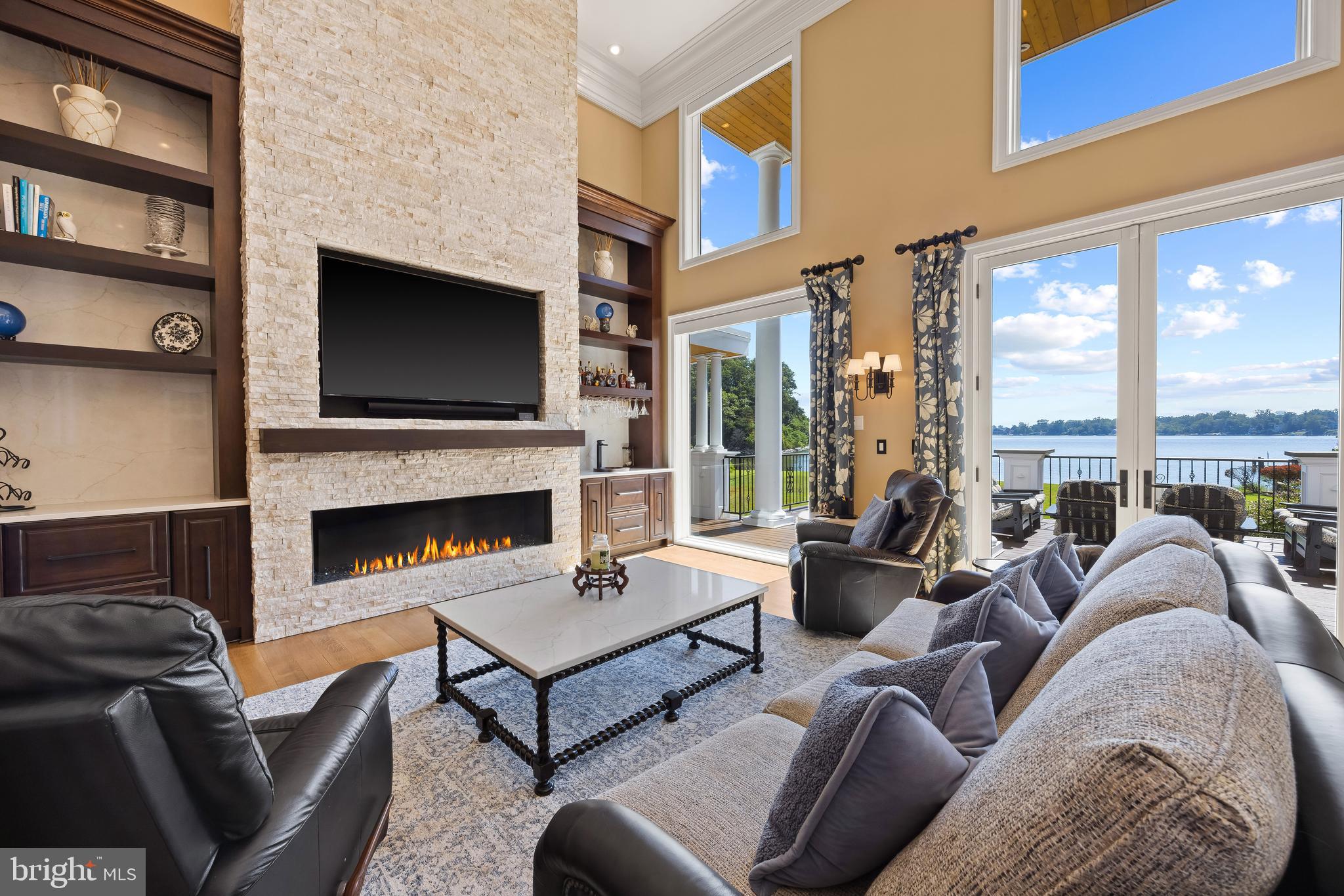 125 South Winchester Road Annapolis, MD 21409 - Photo 9 of 47 a living room with furniture a fireplace and a flat screen tv