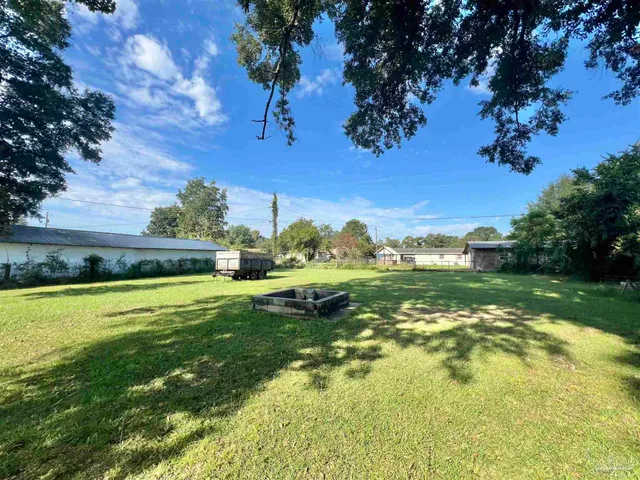 a view of a lake with a yard