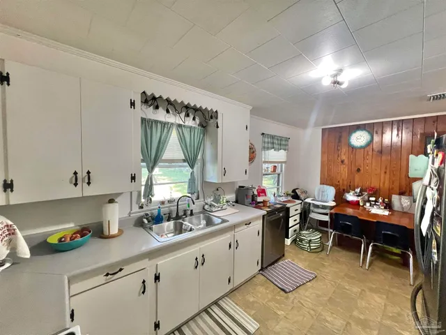 a kitchen with a sink and cabinets
