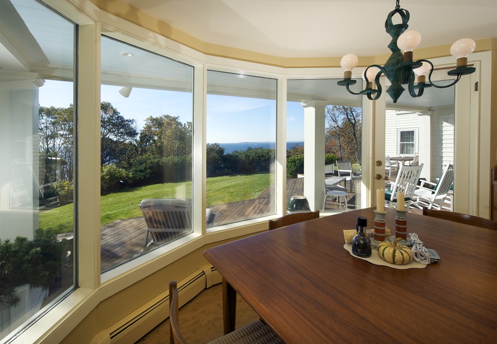 301 Summer Street Manchester, MA 01944 - Photo 5 of 22 a view of a dining room with furniture wooden floor and chandelier