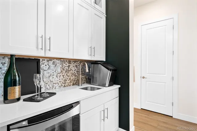 a kitchen with a sink and cabinets