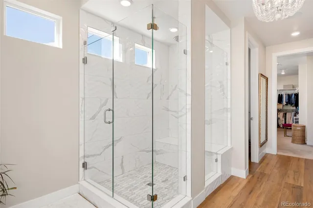 a bathroom with a glass shower door