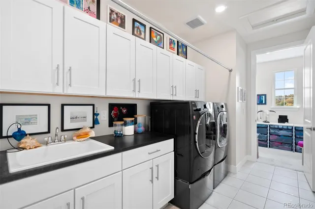 a kitchen with stainless steel appliances granite countertop a refrigerator and a stove