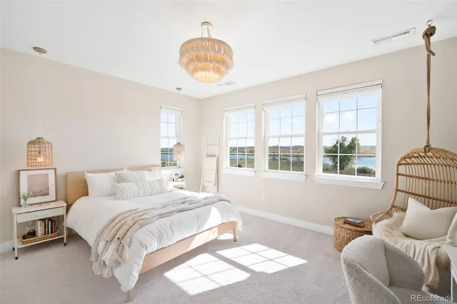 a bedroom with bed and window