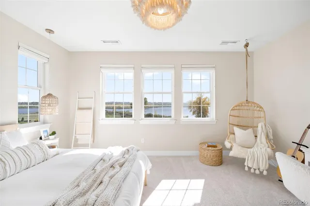 a bedroom with bed and window