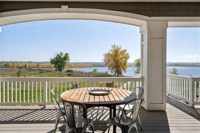 a view of a chairs and table on the deck