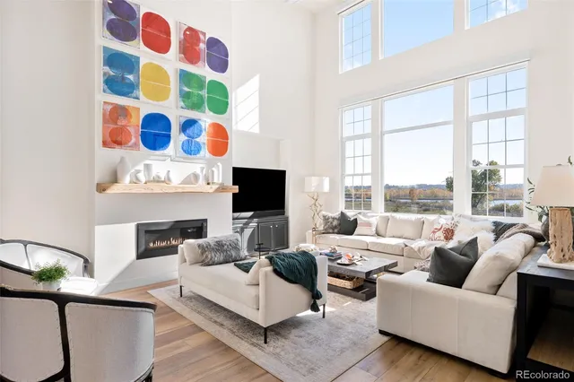 a living room with furniture fireplace and flat screen tv