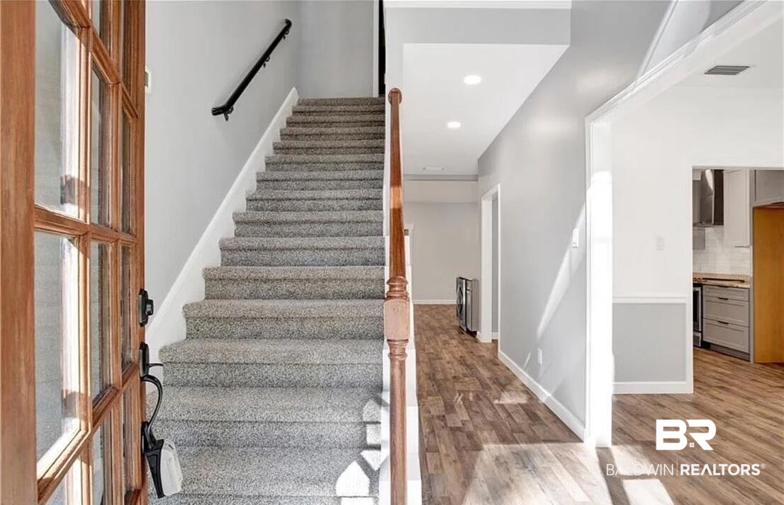 632 Ridgewood Drive Daphne, AL 36526 - Photo 5 of 36 Stairs featuring wood-type flooring
