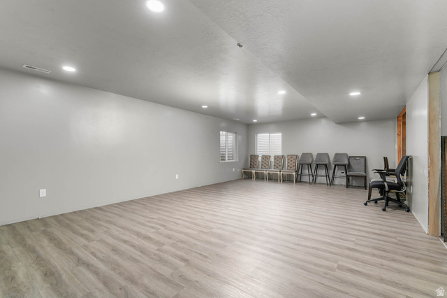 5686 Duke Lane Tooele, UT 84074 - Photo 31 of 38 Miscellaneous room featuring light wood-style floors and recessed lighting