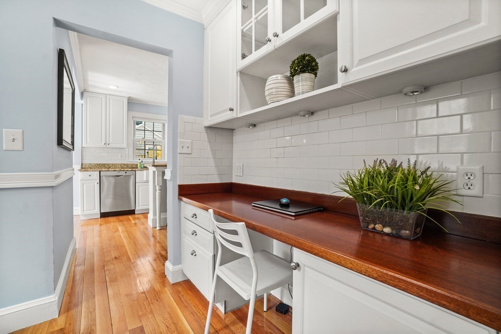 1147 Brook Road Milton, MA 02186 - Photo 12 of 31 a kitchen with stainless steel appliances a sink and a white cabinets