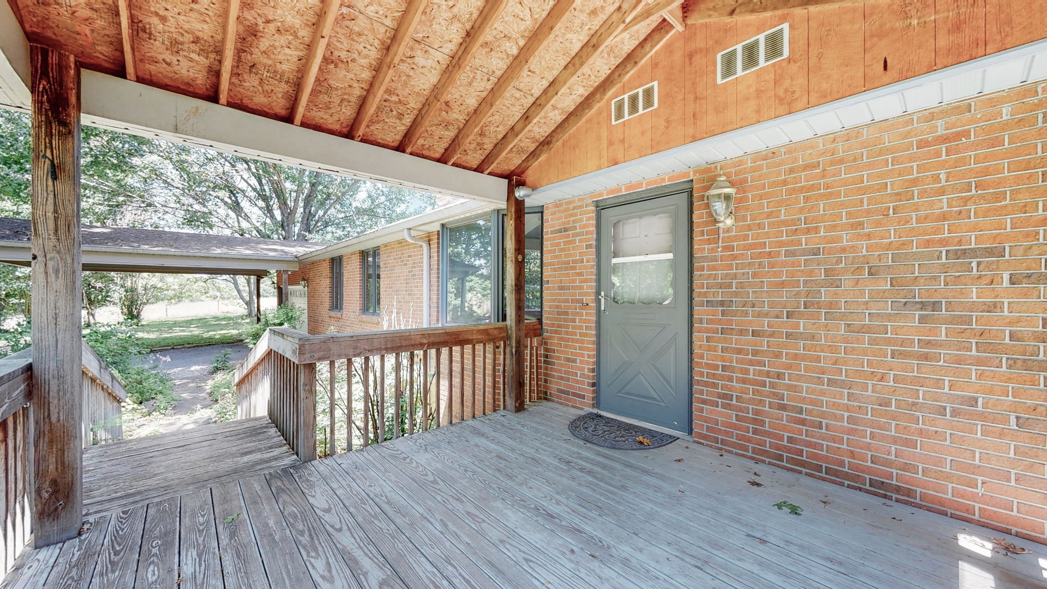 6714 Lee Road Smyrna, TN 37167 - Photo 19 of 70 a view of a porch with wooden floor and outdoor space