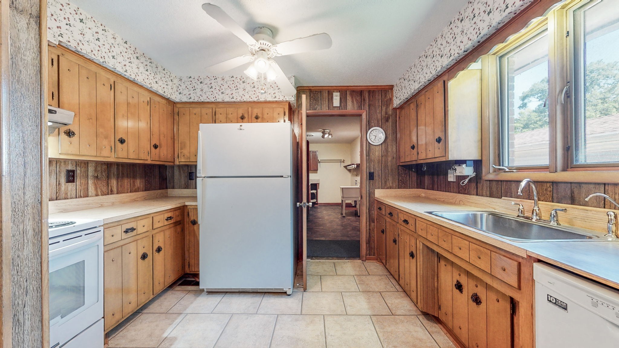 6714 Lee Road Smyrna, TN 37167 - Photo 28 of 70 a kitchen with stainless steel appliances granite countertop a refrigerator a sink dishwasher a stove with white cabinets and countertops