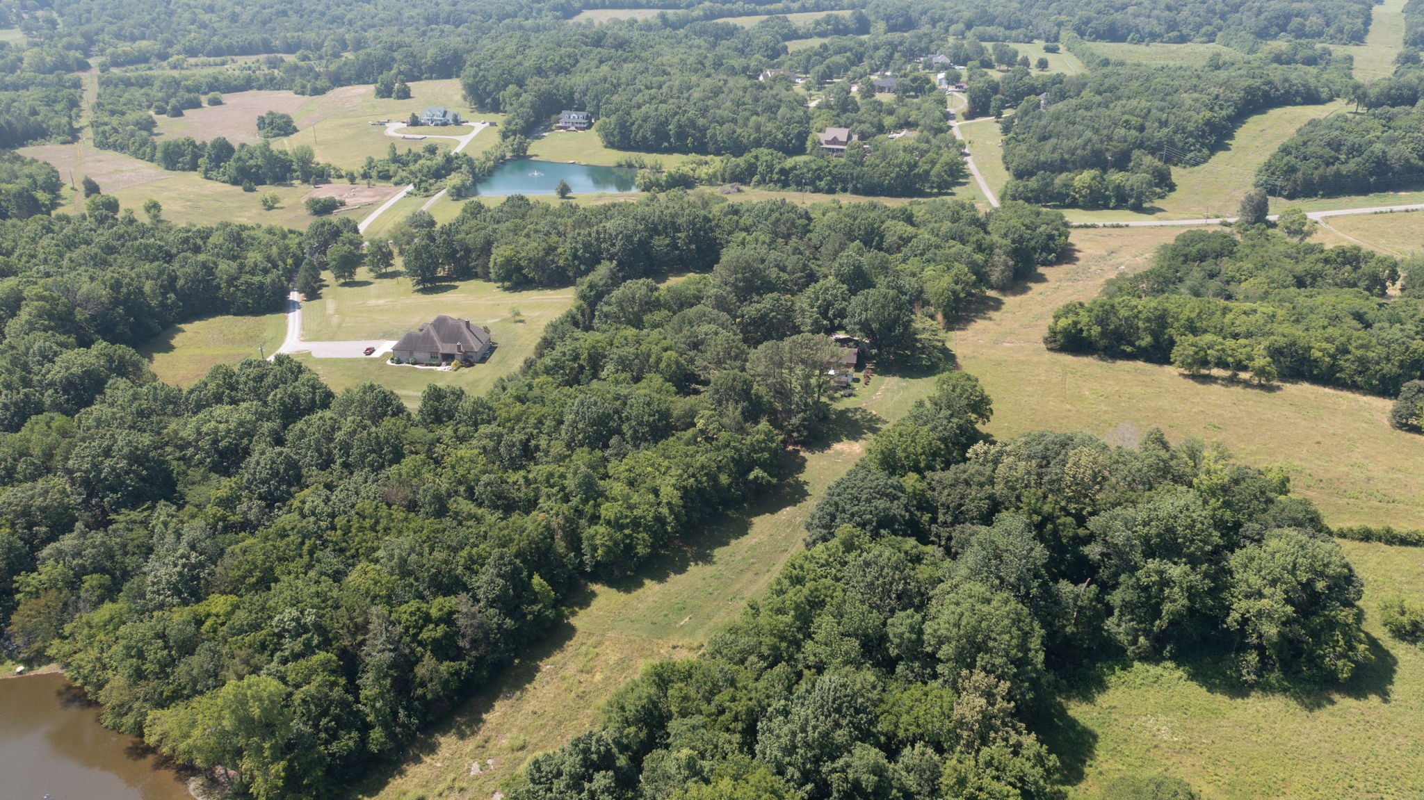 6714 Lee Road Smyrna, TN 37167 - Photo 64 of 70 an aerial view of a house with a yard and lake view