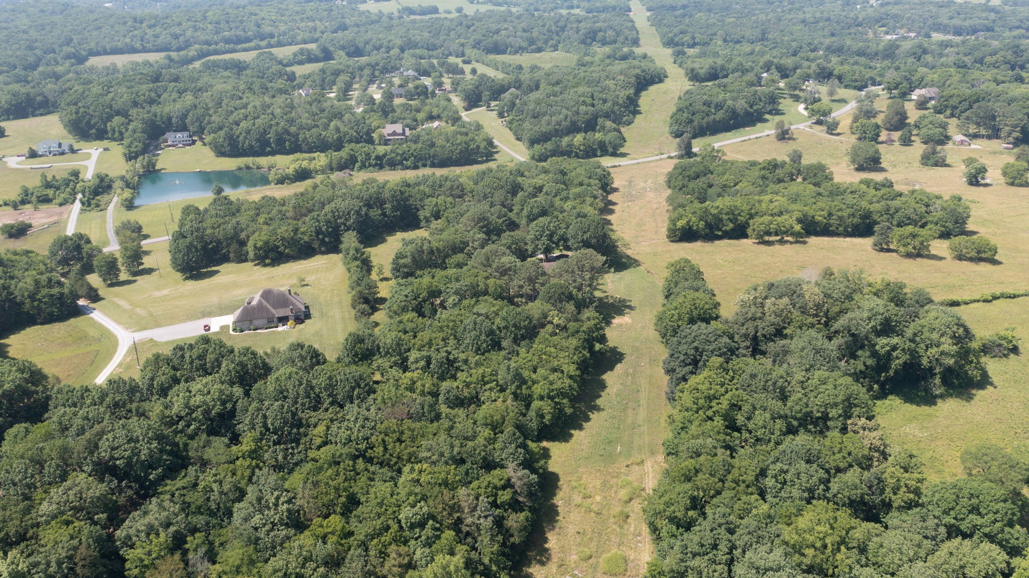 6714 Lee Road Smyrna, TN 37167 - Photo 65 of 70 an aerial view of residential houses with outdoor space and trees