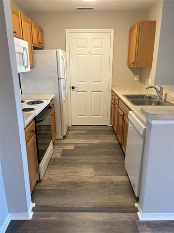 a bathroom with a sink a mirror and a toilet