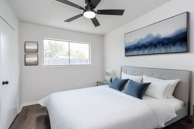 a bedroom with a large bed and a view of a bedroom