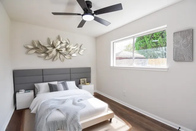 a bedroom with a bed and a window