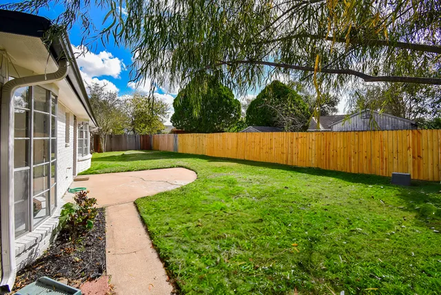 a view of a backyard with a garden