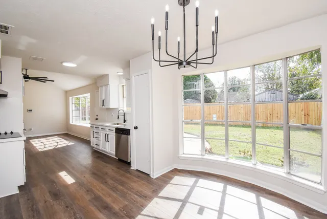 a view of a kitchen with a large window