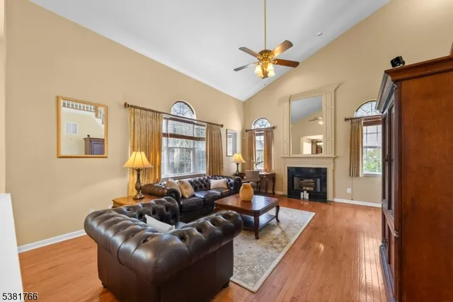 a living room with furniture or fireplace and a wooden floor