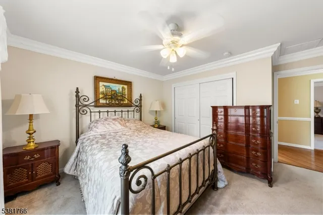 a bed room with a bed and a chandelier