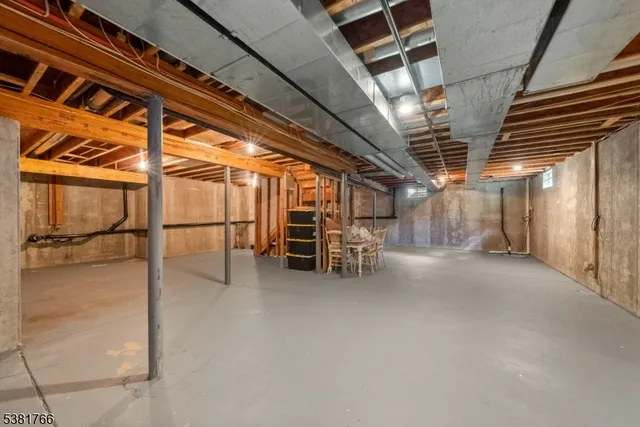 a view of empty room with wooden walls
