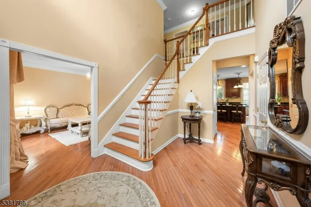 a view of a livingroom with furniture and hardwood floor