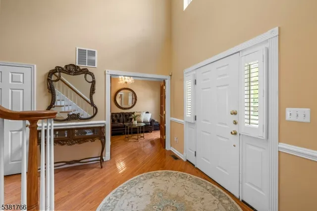 a view of a livingroom with furniture and stairs