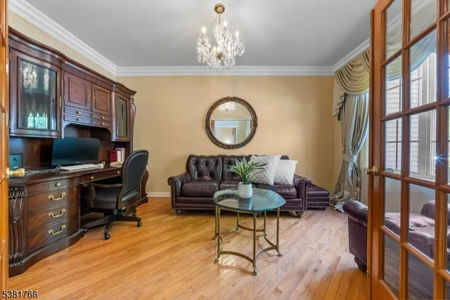 a living room with furniture a rug and a flat screen tv