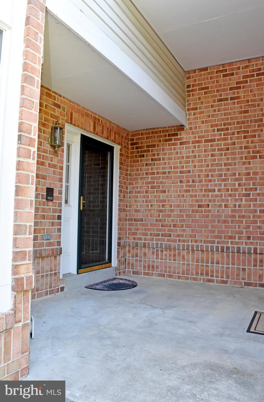 9238 Ispahan Loop Laurel, MD 20708 - Photo 26 of 30 Covered front entry & connects to garage