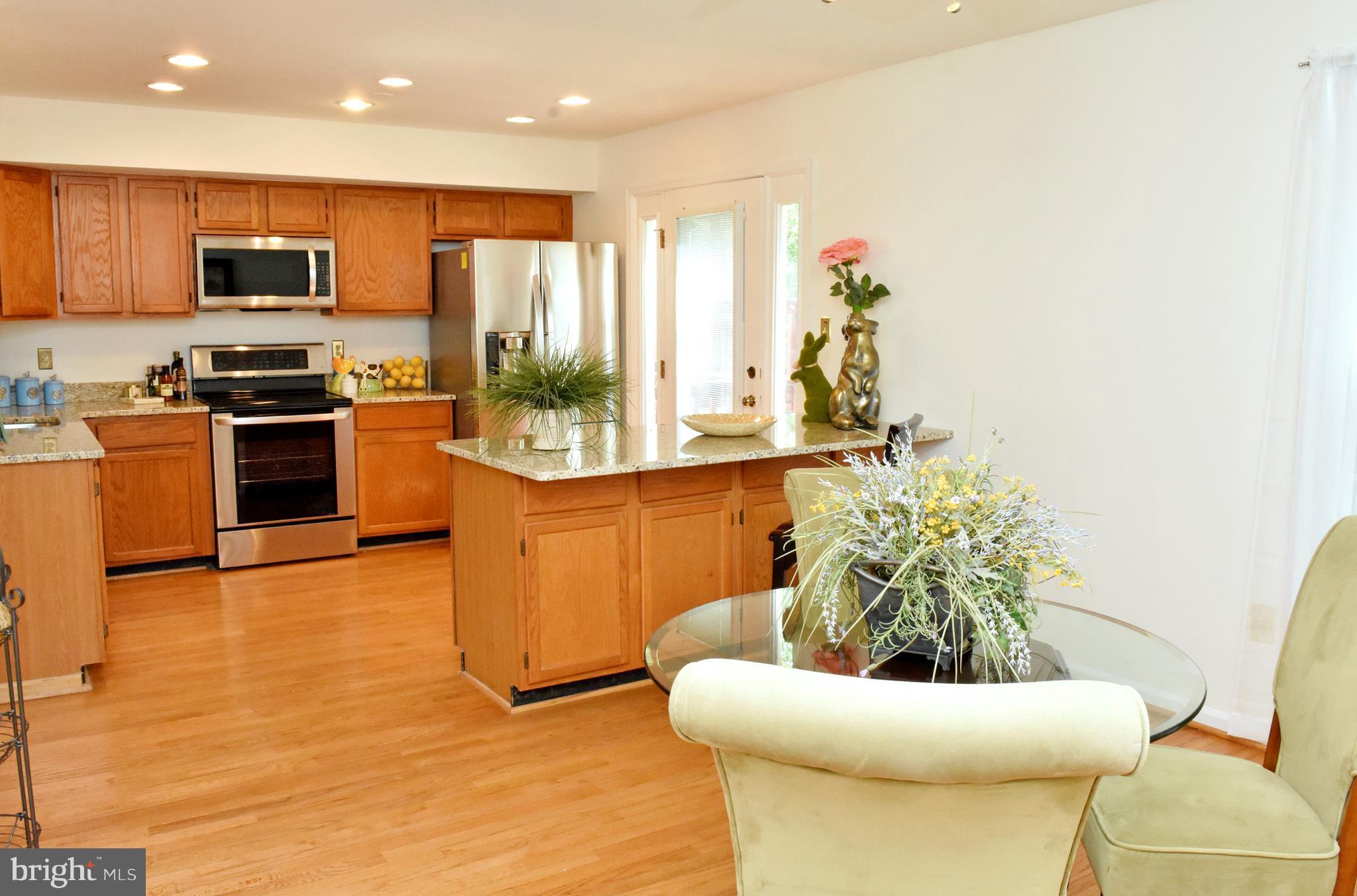 9238 Ispahan Loop Laurel, MD 20708 - Photo 8 of 30 Kitchen hardwood floors on main