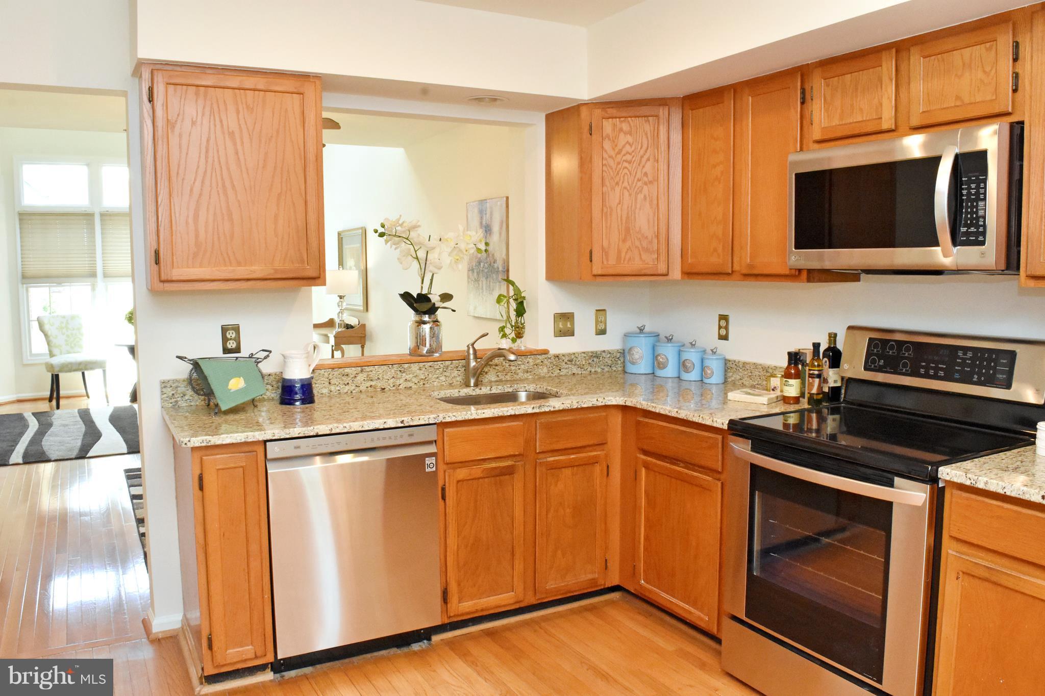 9238 Ispahan Loop Laurel, MD 20708 - Photo 10 of 30 Kitchen pass thru to dining