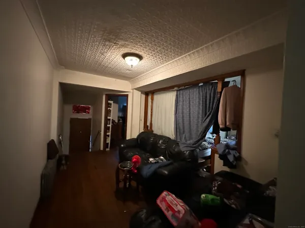 a living room with furniture and a closet