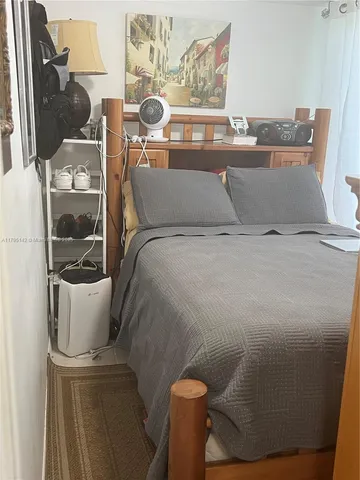 a living room with furniture and a chair