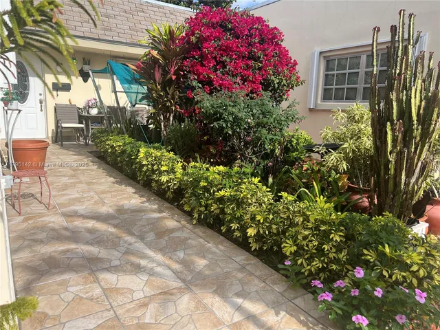 a view of a potted flower in the corridor